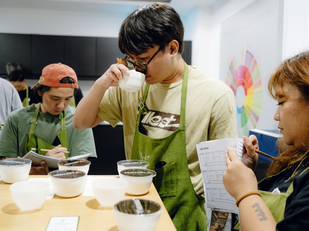 A barista at Archers Coffee assesses coffee aroma during a cupping.