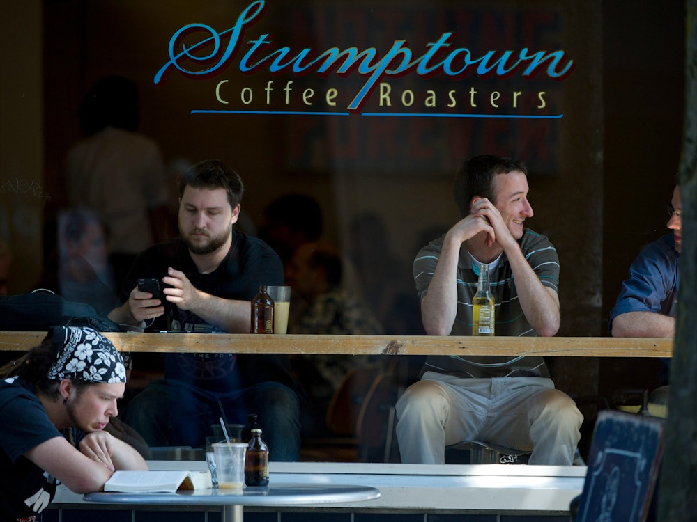 Customers sit at a Stumptown coffee shop in Portland, Oregon.