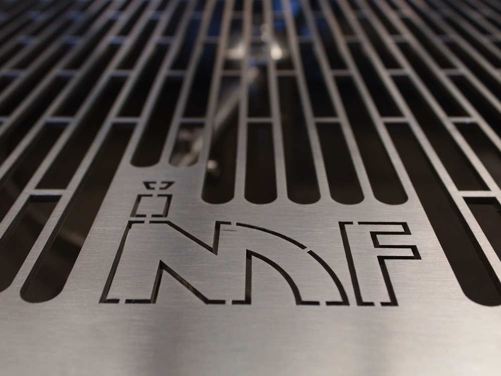 A close up of the IMF logo on a coffee roaster.