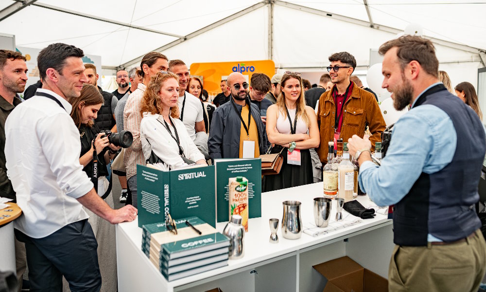Martin Hudak provides a mixology presentation at a coffee event.