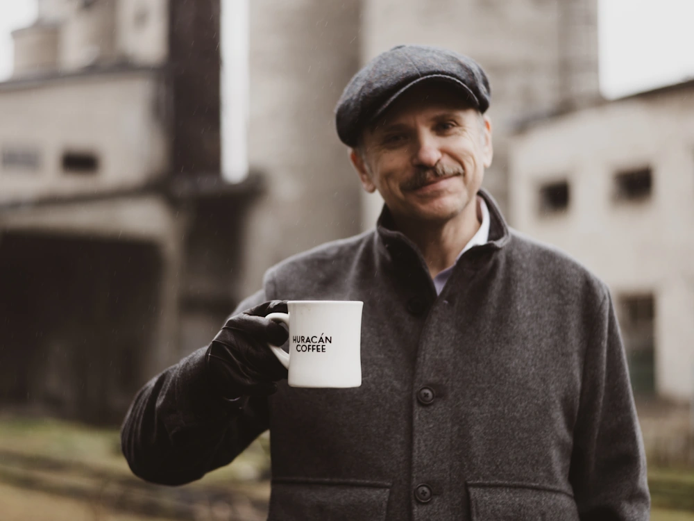 Vytautus Kratulis, CEO and founder of Huracán Coffee in Vilnius, Lithuania holds a mug of filter coffee.
